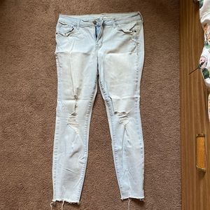 Pale blue ripped jeans